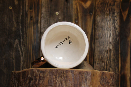 Bollocks. Small tea cup