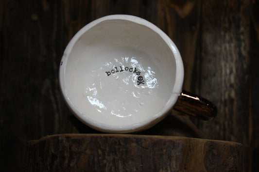 Bollocks. Small cappuccino cup